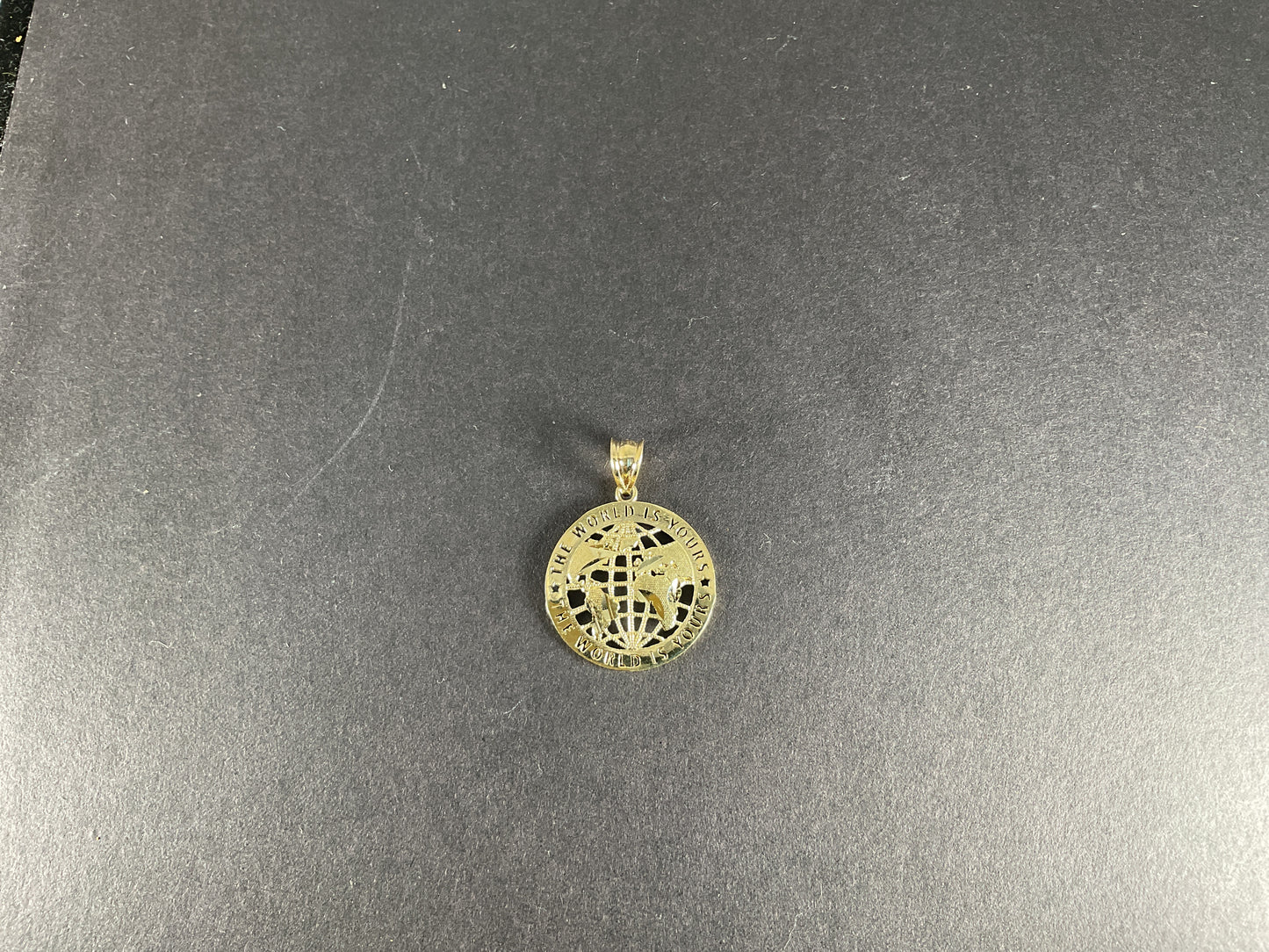 10K The World is Yours  Pendant. 1.3 gm